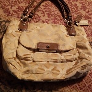 Tan logo coach purse